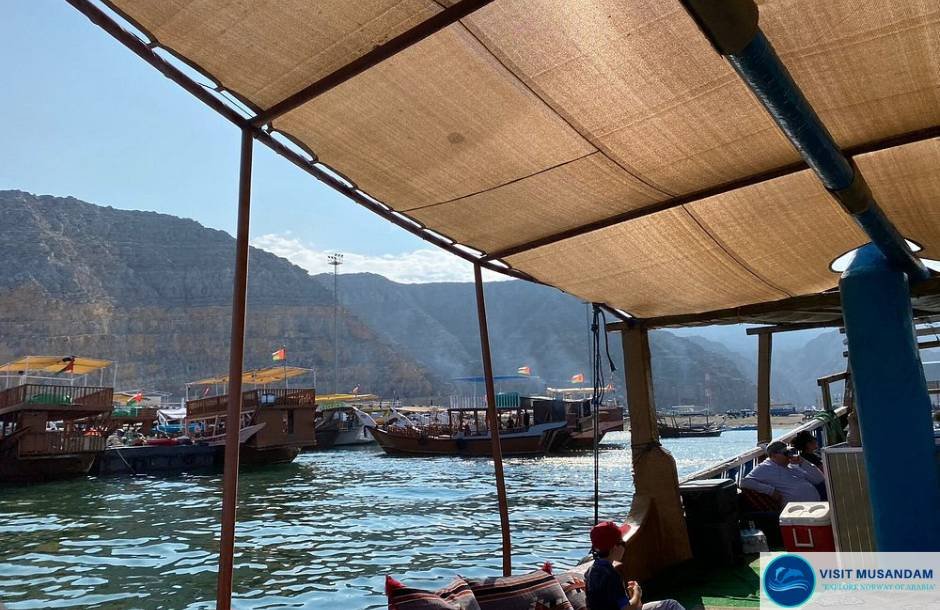 Why is dhow cruising the highlight of Musandam Fjords?